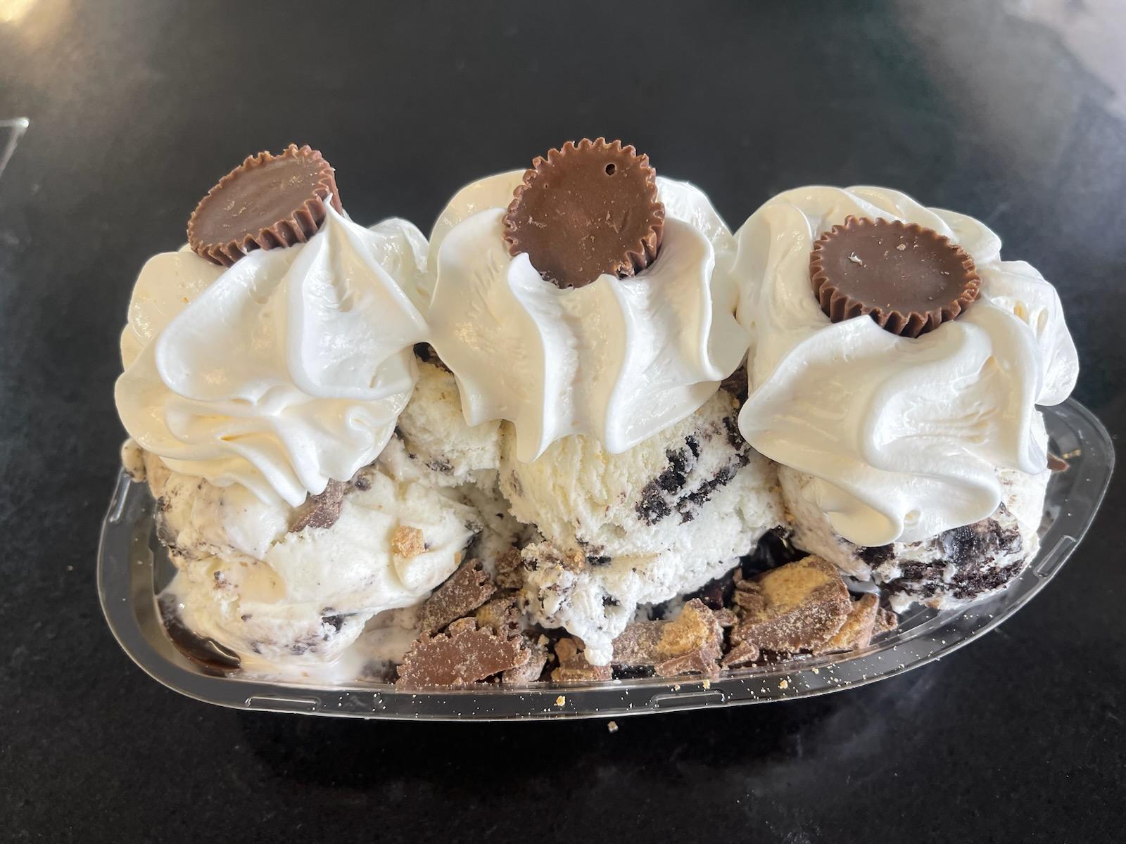 A peanut butter cup ice cream sundae with whipped cream
